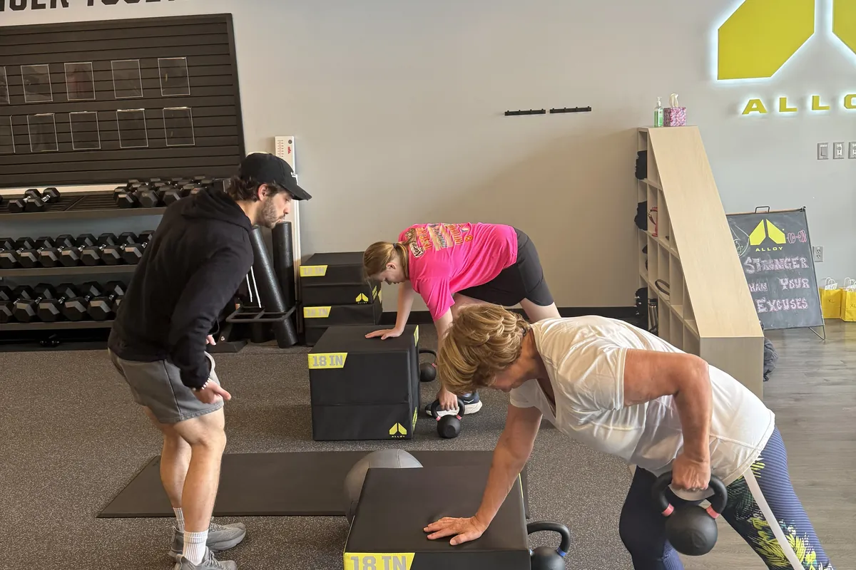 Coach leading a small group training session at Alloy Personal Training Fairfax City